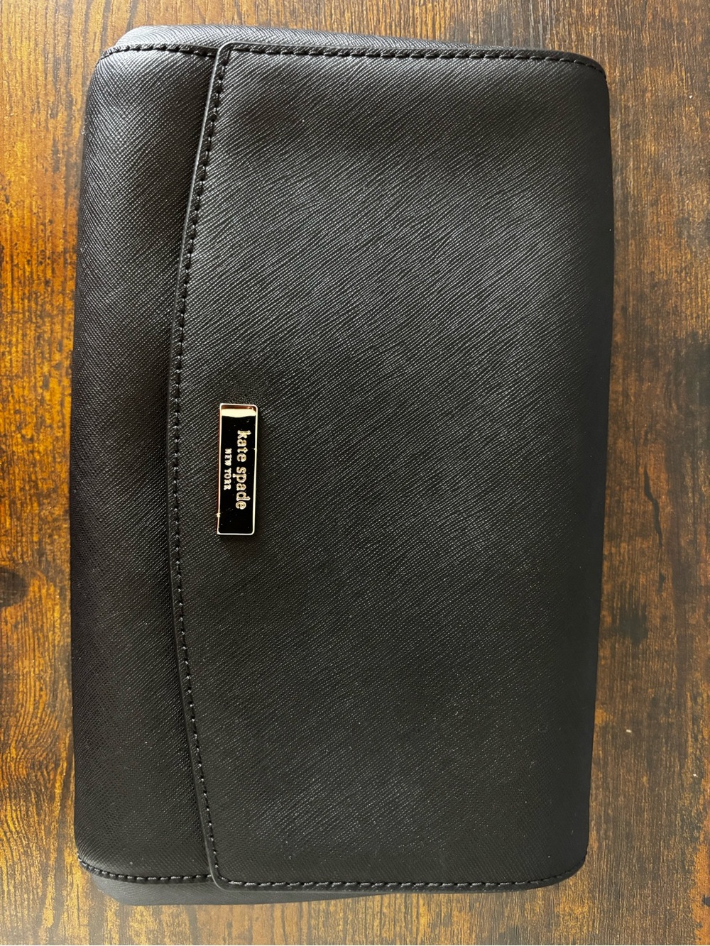 kate spade black crossbody wallet with gold logo plaque